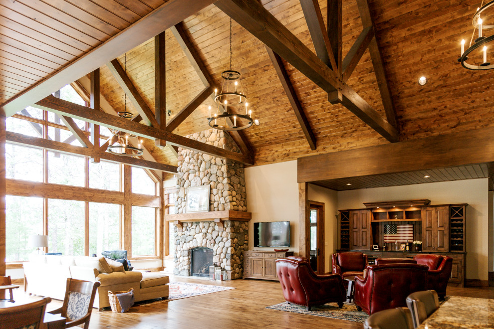 Example of a mountain style home design design in Denver