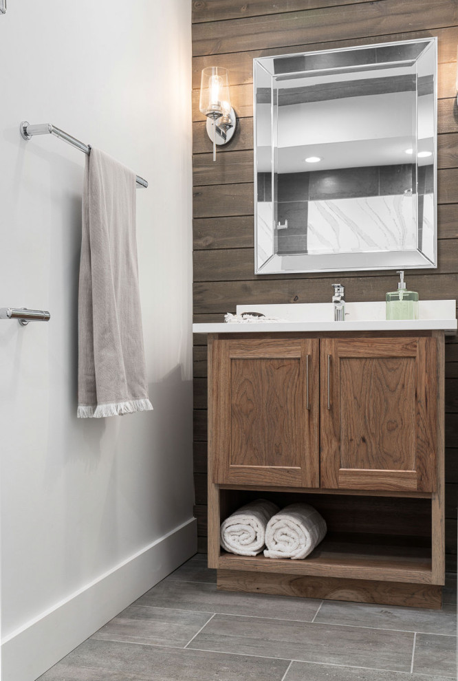 This is an example of a small country bathroom in Columbus with shaker cabinets, light wood cabinets, gray tile, wood-look tile, grey walls, porcelain floors, an undermount sink, engineered quartz benchtops, grey floor, white benchtops, a single vanity and a freestanding vanity.