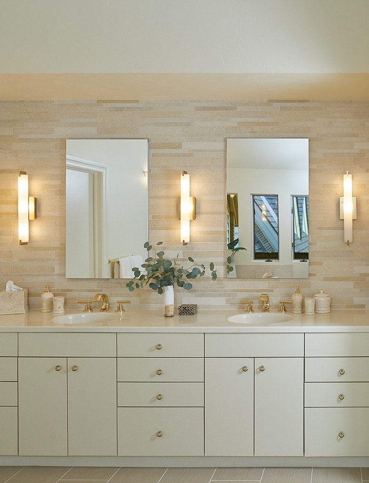 Inspiration for a transitional master bathroom with flat-panel cabinets, beige cabinets, beige tile, beige walls, an integrated sink, beige floor, beige benchtops, a double vanity and a built-in vanity.