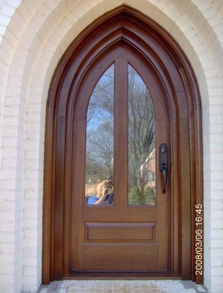 Example of a transitional front door design in Charlotte with a dark wood front door