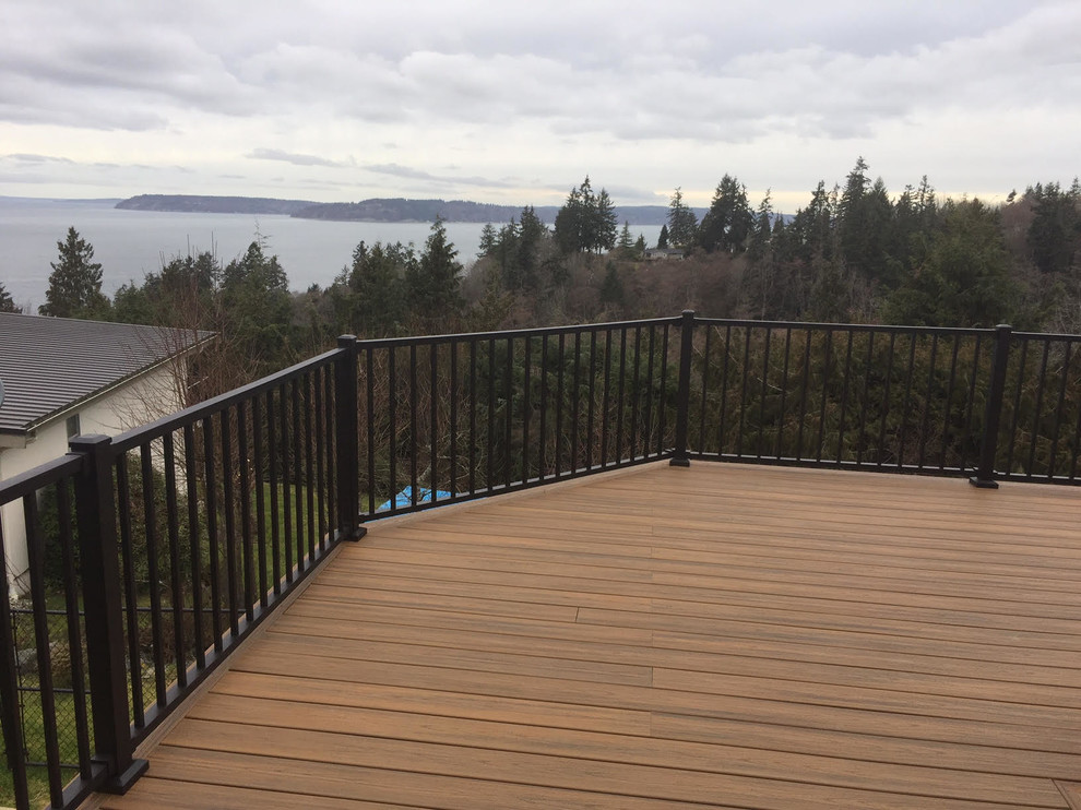 Inspiration for a large transitional backyard deck remodel in Seattle with decking and no cover