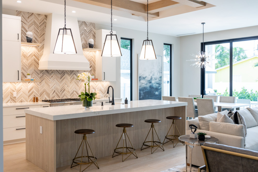 Kitchen - transitional porcelain tile, brown floor and coffered ceiling kitchen idea in Miami with a farmhouse sink, flat-panel cabinets, light wood cabinets, quartz countertops, multicolored backsplash, marble backsplash, stainless steel appliances, an island and white countertops