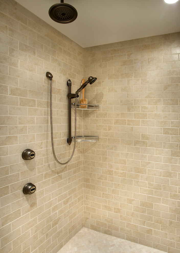 This is an example of a country bathroom in Columbus with an open shower and beige tile.