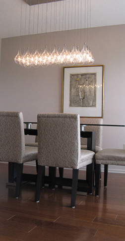 Small classic enclosed dining room in Ottawa with beige walls and medium hardwood flooring.