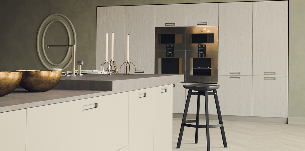 Design ideas for a mid-sized contemporary eat-in kitchen in Toronto with flat-panel cabinets and with island.