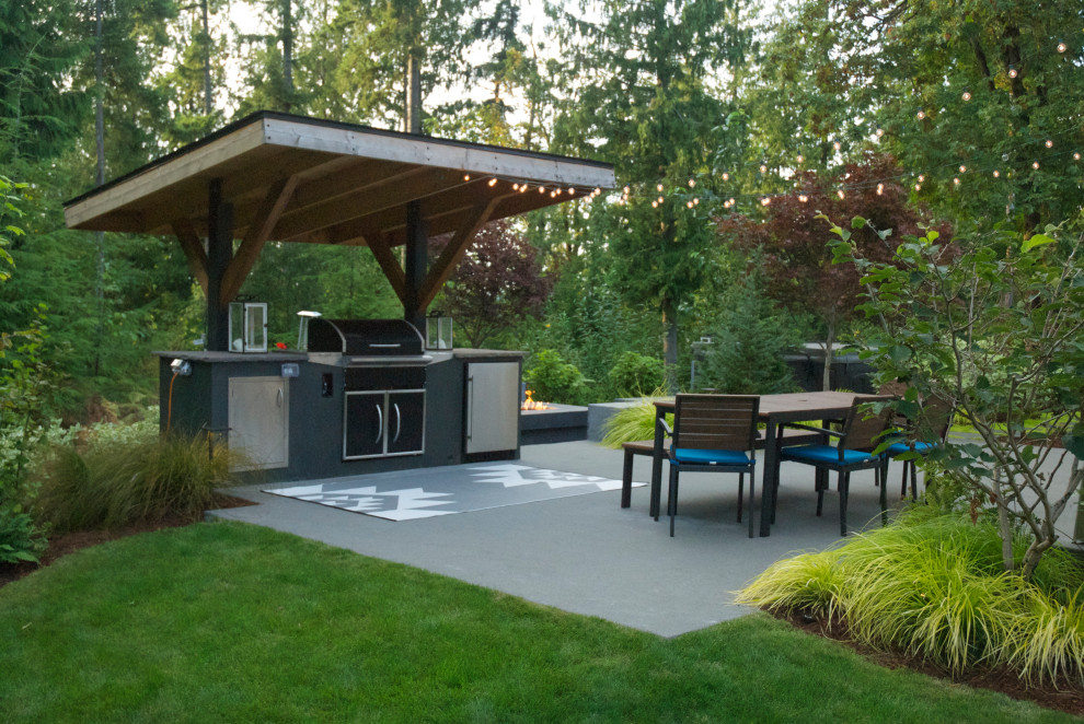 This is an example of a medium sized contemporary back patio in Seattle.
