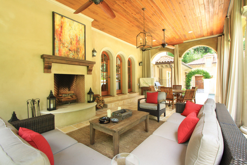 Inspiration for a mediterranean verandah in Atlanta with a fire feature.