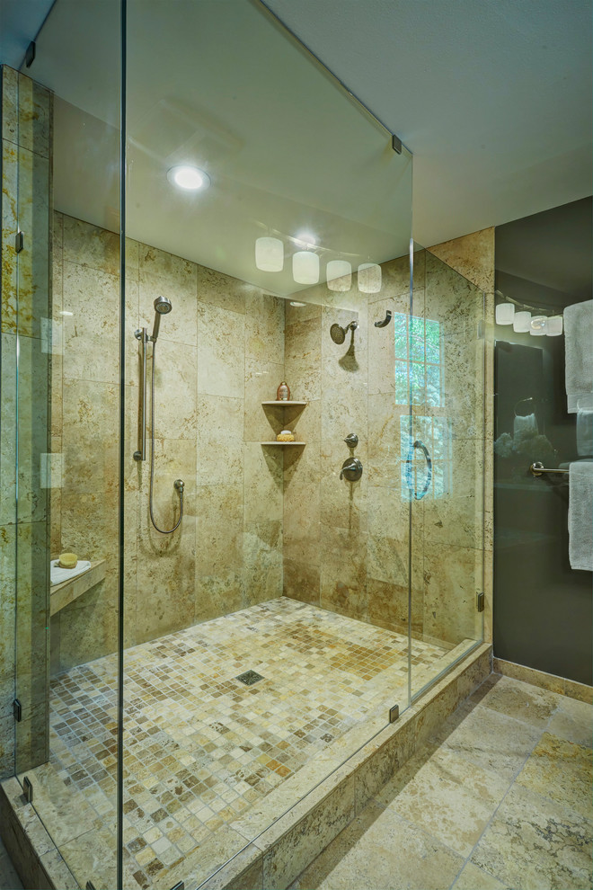 Design ideas for a large transitional master bathroom in Milwaukee with shaker cabinets, dark wood cabinets, a corner shower, a bidet, beige tile, stone tile, beige walls, travertine floors, an undermount sink and granite benchtops.