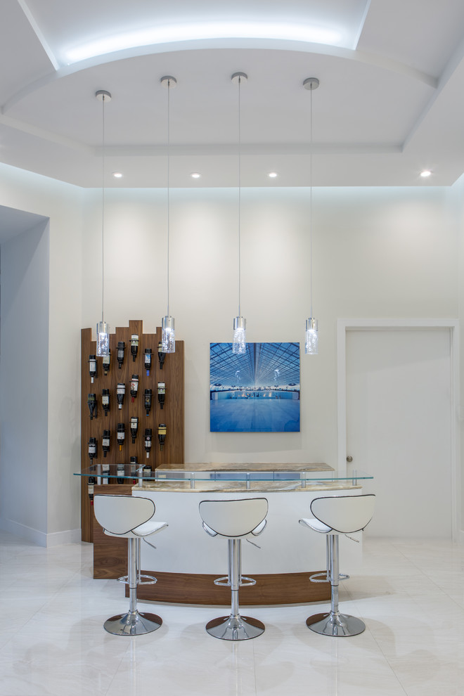 This is an example of a large contemporary single-wall seated home bar in Miami with flat-panel cabinets, white cabinets, onyx benchtops, porcelain floors, white floor, no sink, white splashback and timber splashback.