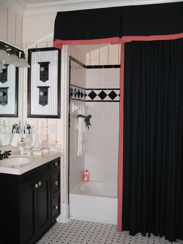 Inspiration for a traditional bathroom in Charlotte with an alcove tub, a shower/bathtub combo and black and white tile.
