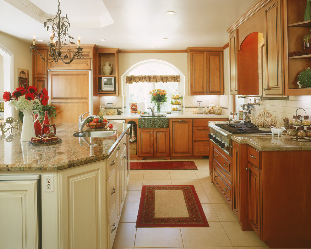 Inspiration for a large traditional l-shaped separate kitchen in San Diego with a farmhouse sink, raised-panel cabinets, granite benchtops, beige splashback, subway tile splashback, medium wood cabinets, stainless steel appliances, porcelain floors, with island and white floor.