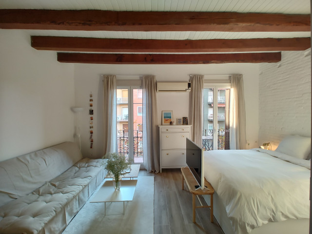 Actualizaci&oacute;n para un piso muy acogedor en el coraz&oacute;n de Barcelona scandinavian-living-room