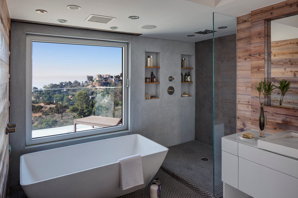 Contemporary master bathroom in Los Angeles with white cabinets, a freestanding tub, an open shower, grey walls, a vessel sink, flat-panel cabinets, metal tile and an open shower.