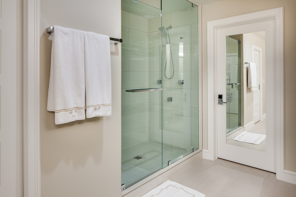 Design ideas for a mid-sized contemporary master bathroom in Miami with shaker cabinets, white cabinets, a corner shower, a two-piece toilet, beige walls, ceramic floors, an undermount sink and solid surface benchtops.