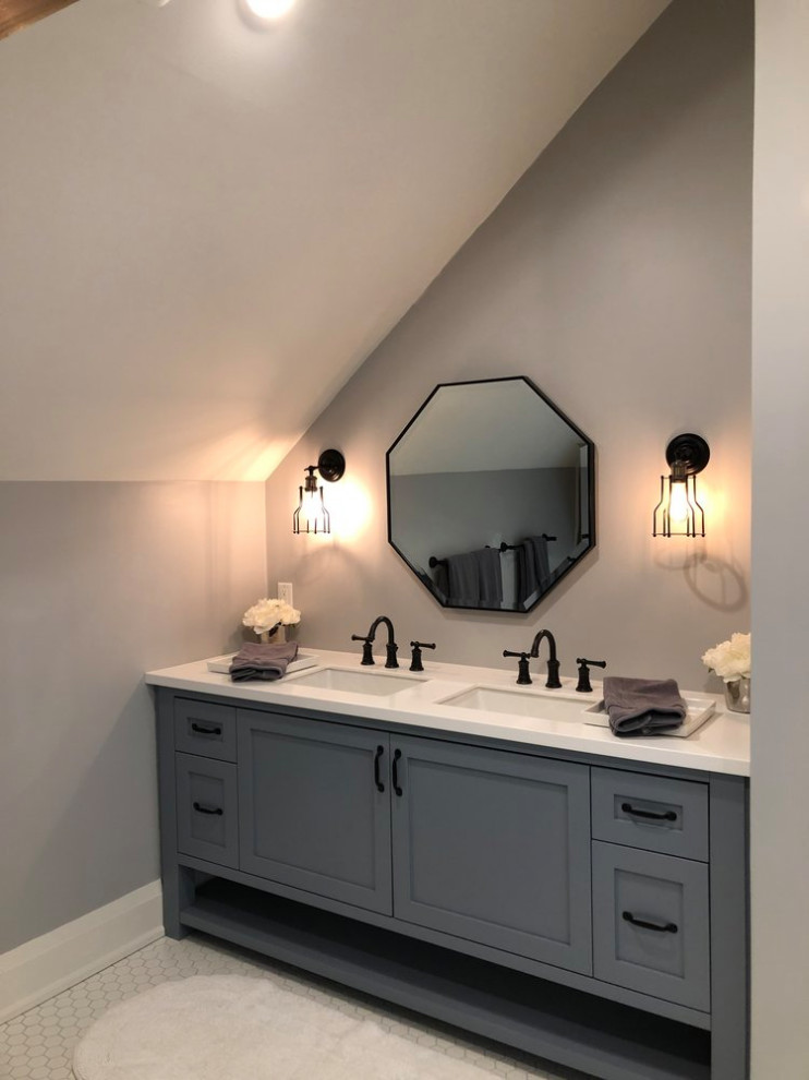 Mid-sized beach style kids bathroom in Toronto with shaker cabinets, blue cabinets, grey walls, ceramic floors, an undermount sink, solid surface benchtops, white floor and white benchtops.