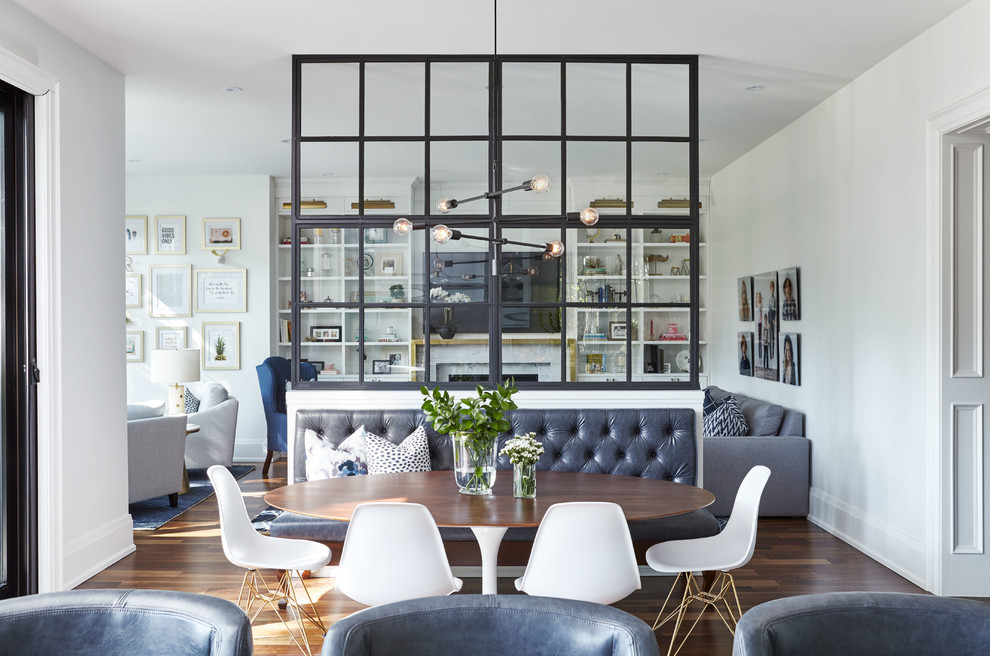 Transitional open plan dining in Toronto with brown floor, white walls and dark hardwood floors.