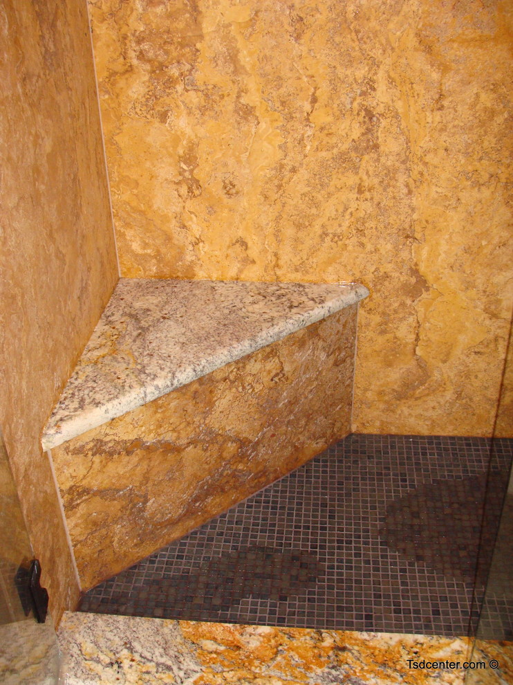 Example of a mid-sized stone slab doorless shower design