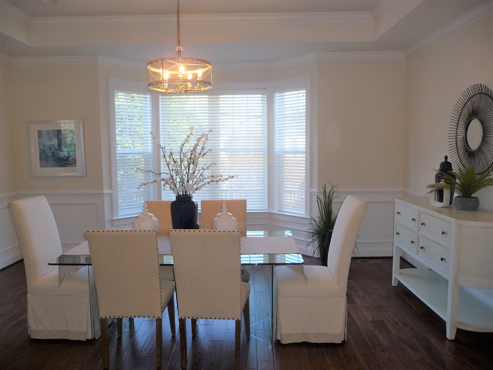 Large contemporary separate dining room in DC Metro with beige walls and dark hardwood floors.