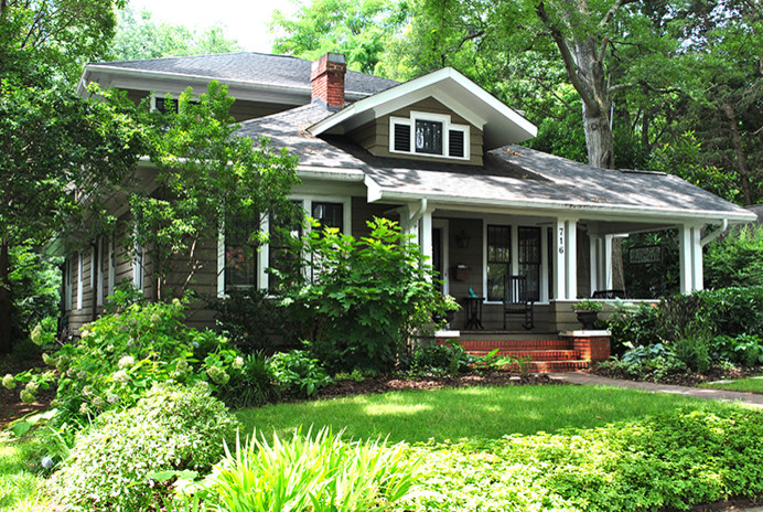 Inspiration for a mid-sized arts and crafts two-storey grey exterior in Charlotte with vinyl siding and a hip roof.