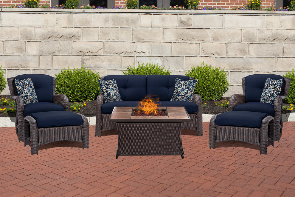 Transitional backyard home design photo with a fire pit