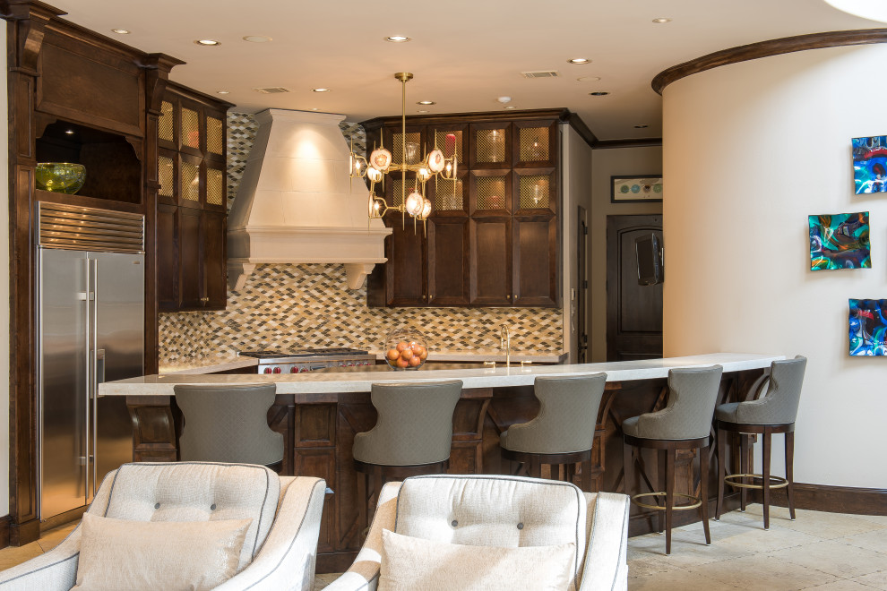 Example of a mid-sized transitional u-shaped travertine floor and beige floor kitchen design in Houston with shaker cabinets, dark wood cabinets, granite countertops, multicolored backsplash, glass sheet backsplash, two islands, stainless steel appliances and white countertops
