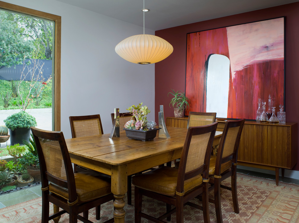 Inspiration for a midcentury dining room in Santa Barbara with white walls.