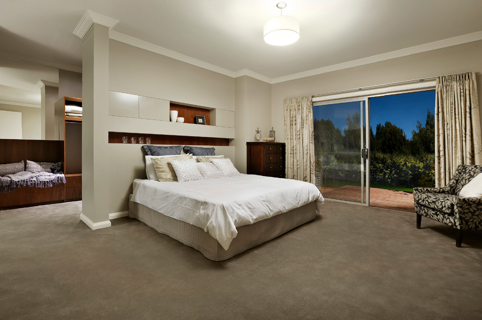This is an example of a mid-sized contemporary master bedroom in Sydney with beige walls and carpet.