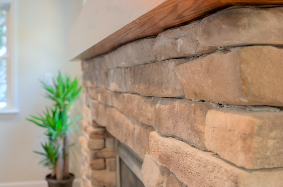 Inspiration for a transitional open concept light wood floor home design remodel with gray walls and a wall-mounted tv