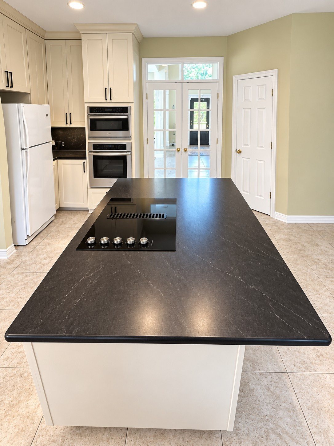 Custom Transitional Kitchen with Cream Shaker Cabinets & Black Countertops