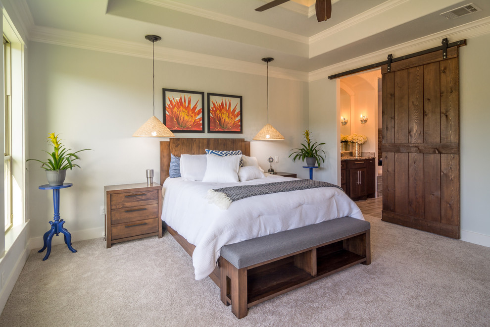 Design ideas for a transitional master bedroom in Dallas with grey walls and carpet.