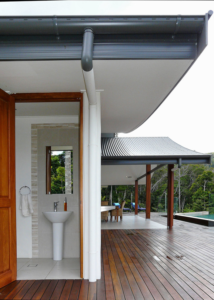 Design ideas for a large tropical deck in Brisbane with a roof extension.