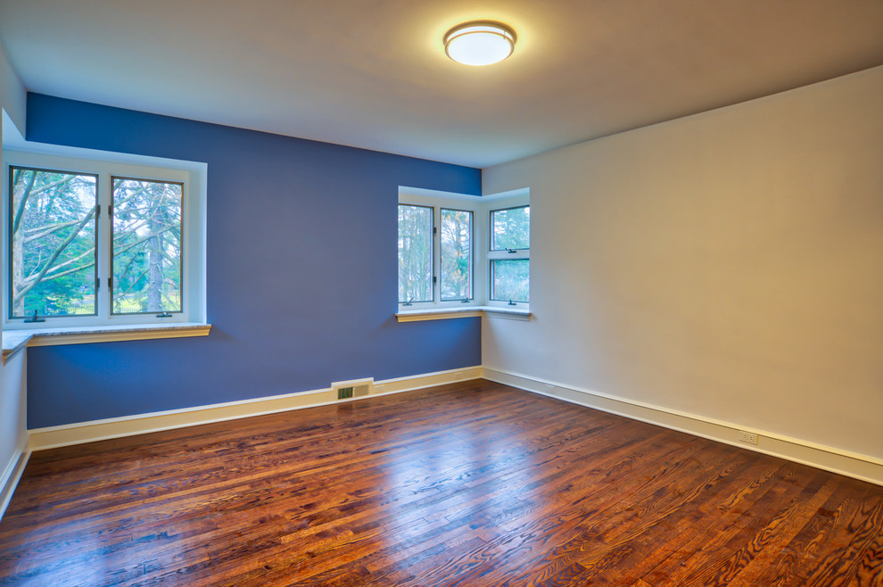 Photo of a mid-sized transitional guest bedroom in Philadelphia with multi-coloured walls and dark hardwood floors.