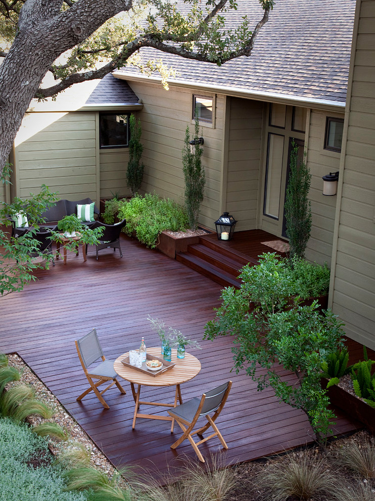 Mid-sized traditional backyard deck in Austin with no cover.