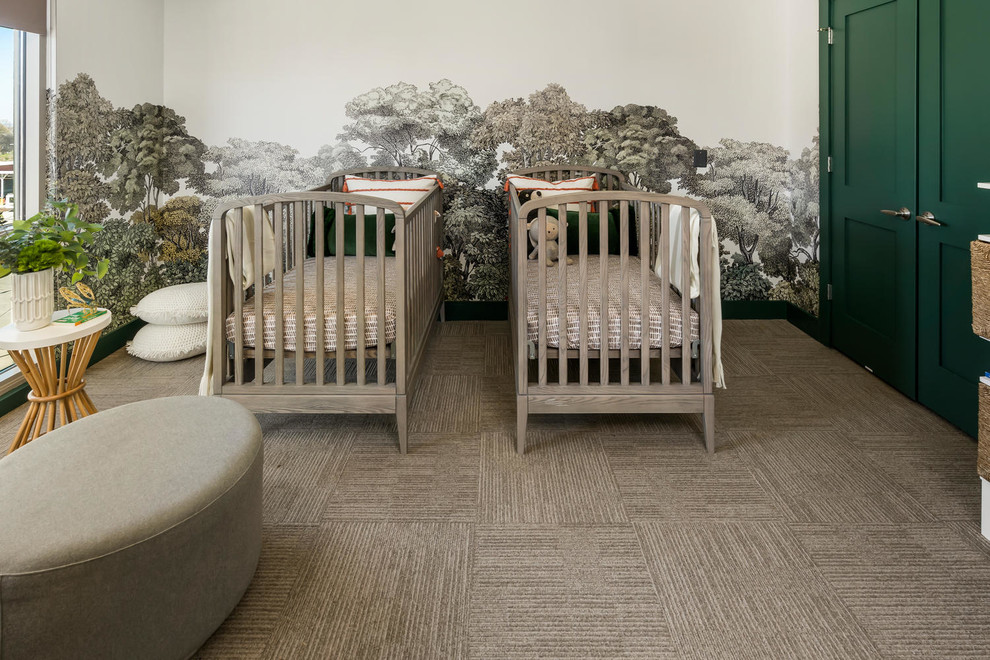 This is an example of a large contemporary gender-neutral nursery in Atlanta with multi-coloured walls, carpet and grey floor.