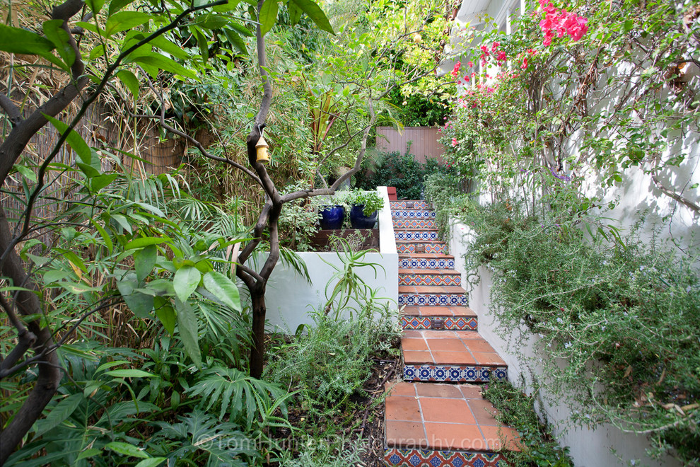 Design ideas for a large side yard patio in Los Angeles with a container garden, tile and no cover.