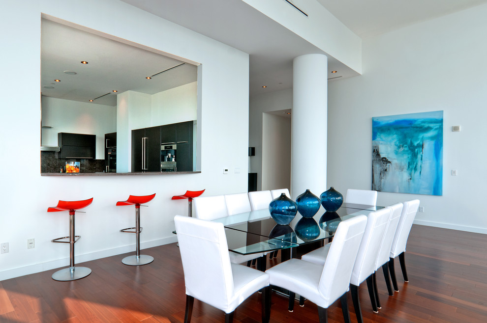 Contemporary dining room in Dallas with white walls.
