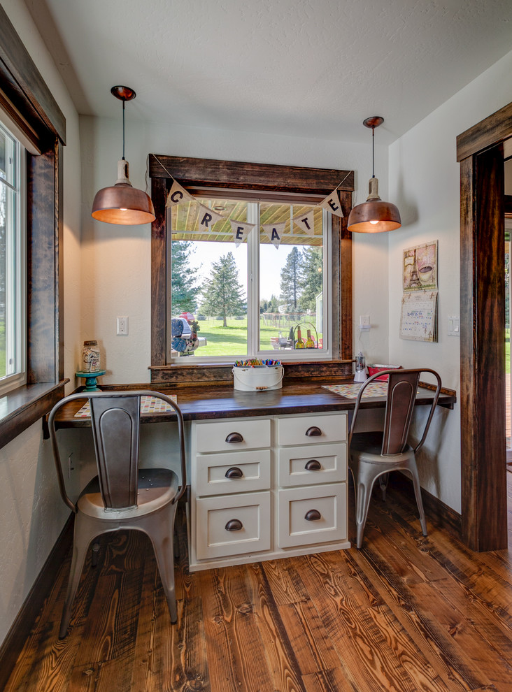 Design ideas for a small country study room in Seattle with white walls, medium hardwood floors and a built-in desk.