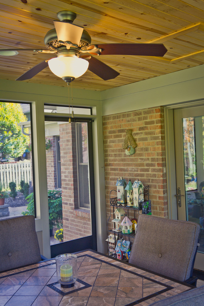 Mid-sized traditional sunroom in Cincinnati with terra-cotta floors and a standard ceiling.