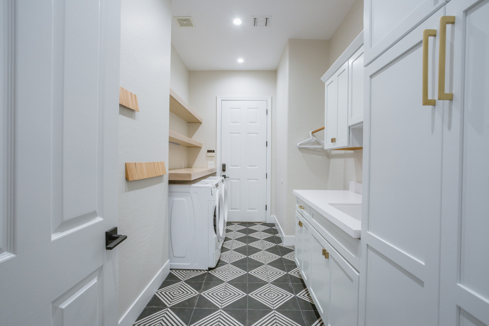 This is an example of a transitional laundry room in Phoenix.