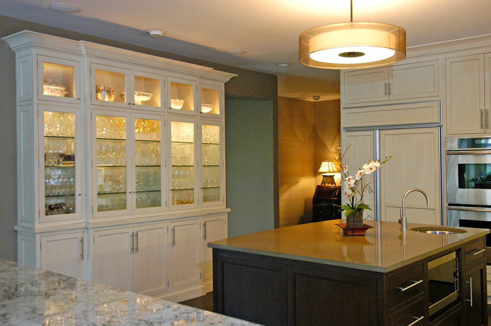 Inspiration for a transitional eat-in kitchen remodel in Chicago with flat-panel cabinets, white cabinets and stainless steel appliances