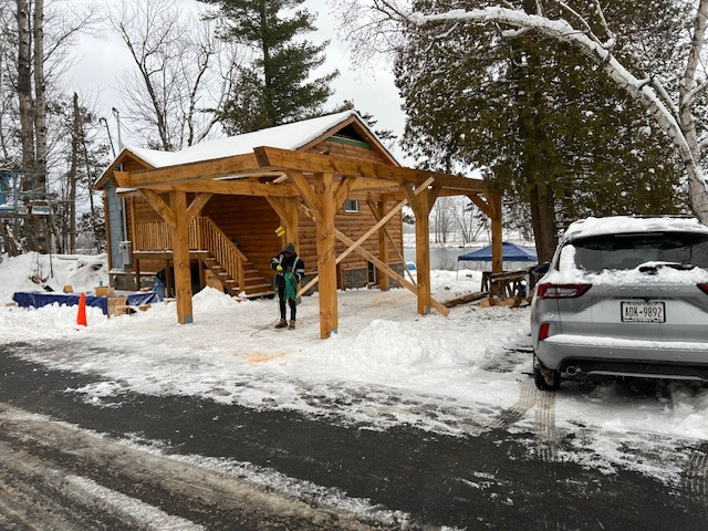 Log Siding, Stamped Concrete and Post and Beam Carport