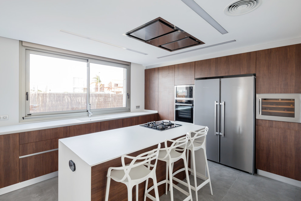 Design ideas for a mid-sized modern kitchen in Other with flat-panel cabinets, dark wood cabinets, quartz benchtops, ceramic floors, with island, grey floor, white benchtop, stainless steel appliances, a single-bowl sink and window splashback.