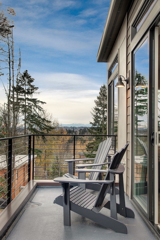 This is an example of a contemporary balcony in Seattle with no cover.