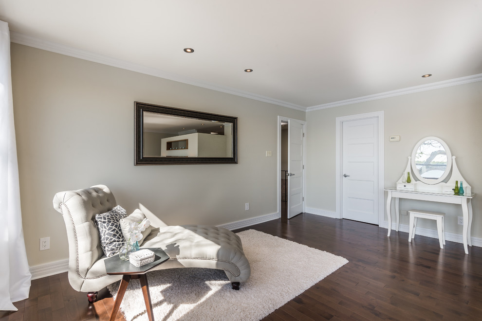 Large contemporary master bedroom in Montreal with beige walls and dark hardwood floors.