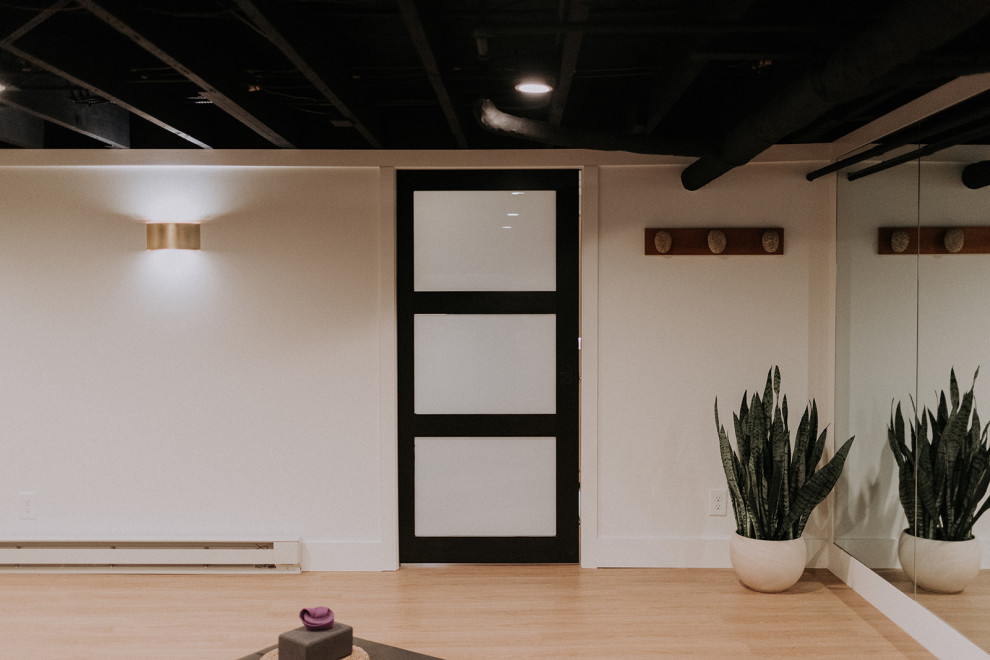 Photo of a transitional home yoga studio in Cleveland.