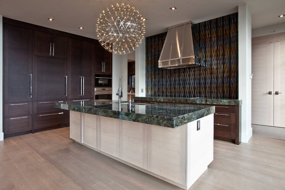 Minimalist galley eat-in kitchen photo in Calgary with flat-panel cabinets, light wood cabinets and an island