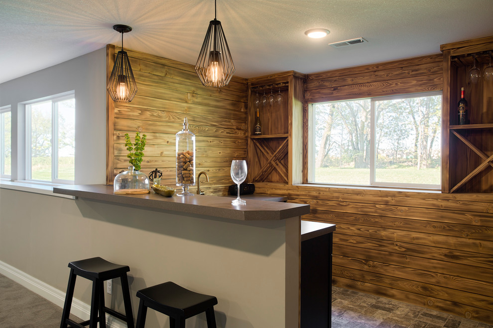 This is an example of a mid-sized transitional l-shaped wet bar in Wichita with an undermount sink, shaker cabinets, black cabinets, laminate benchtops, brown splashback, timber splashback and porcelain floors.