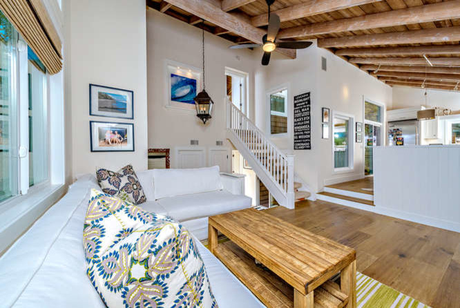 This is an example of a beach style family room in San Diego.