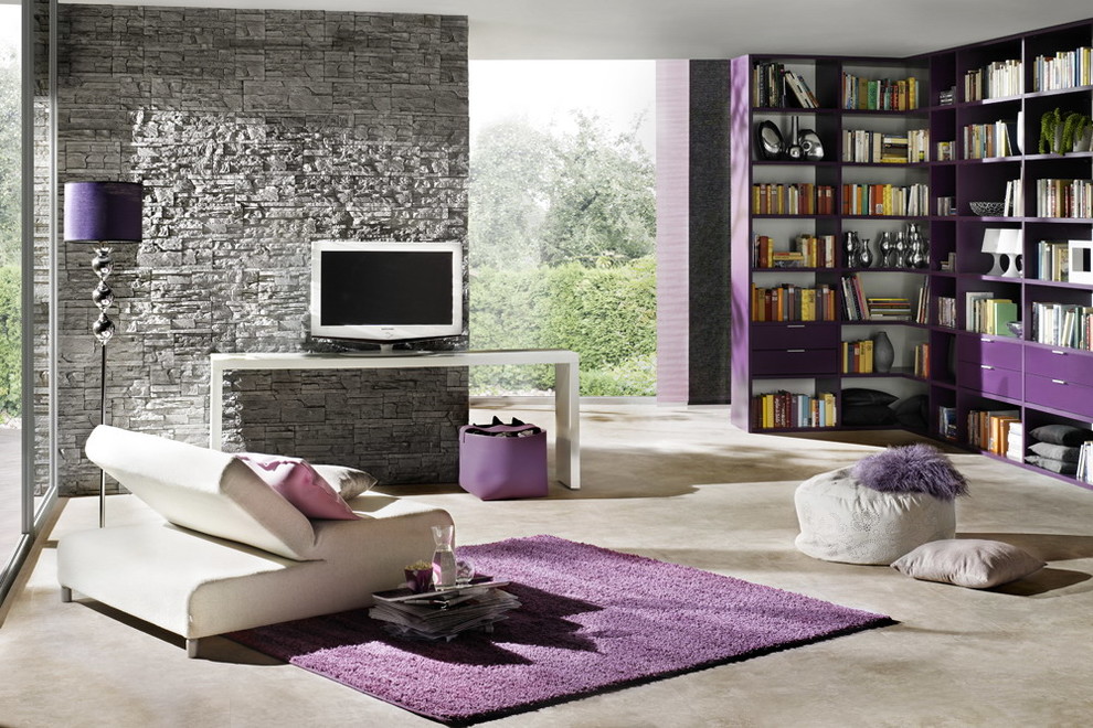 Design ideas for a small contemporary open concept family room in New York with grey walls, a library, concrete floors and a freestanding tv.