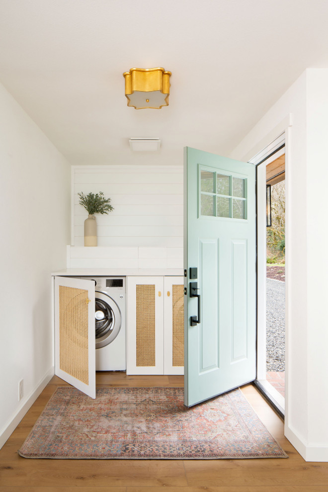 Design ideas for a coastal utility room in Seattle with feature lighting.